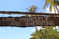 An inscription Ã¢â¬ÅLove yourself and everyoneÃ¢â¬Â on the wooden abandoned hut.